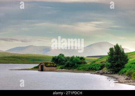 Loch Loyal is a freshwater lake located in the Assynt region of Sutherland, Scotland. Stock Photo