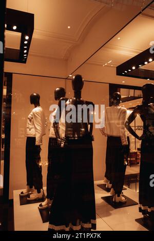 Black stylish mannequins in a shop window dressed in a fashionable outfits. Autumn winter fashion collection Stock Photo