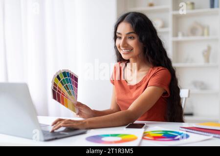 Indian Woman Freelance Graphic Designer Working With Laptop Stock Photo
