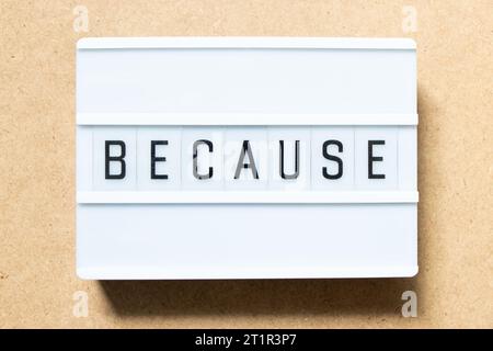 Lightbox with word because on wood background Stock Photo