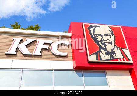 Veliky Novgorod, Russia - August 27, 2023: KFC fast food restaurant logo. Kentucky Fried Chicken (KFC) is the world's second largest restaurant chain Stock Photo