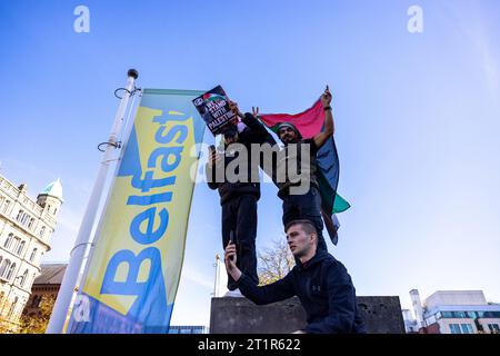 Belfast, UK. 15th Oct, 2023. A few thousand people attend the 'March for Palestine' in the Centre of Belfast to Highlight the Continuing retaliation by the Israel Defence Force in Gaza which has left 2300 death toll to date , after last weekend's massacre of 1300 Israelis by Hamas. There was a small Counter Demonstration by a few individuals who held up the Star of David Flag. The Rally was organised by the Ireland Palestine Solidarity Campaign (IPSC) Credit: Bonzo/Alamy Live News Stock Photo