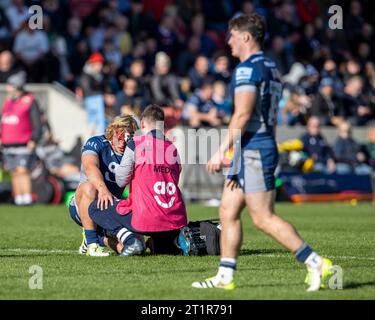 Salford, Lancashire, UK. 15th October 2023; AJ Bell Stadium, Salford, Lancashire, England; Gallagher Premiership Rugby, Sale Sharks versus Northampton; Tommy Taylor of Sale Sharks receives treatment Credit: Action Plus Sports Images/Alamy Live News Stock Photo
