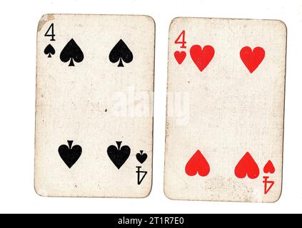 Vintage playing cards featuring a pair of fours on a white background. Stock Photo