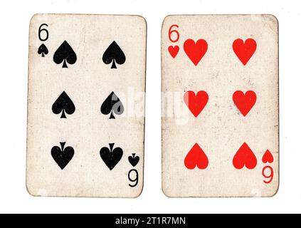 Vintage playing cards featuring a pair of sixes on a white background. Stock Photo