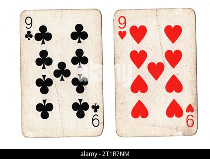 Vintage playing cards featuring a pair of nines on a white background. Stock Photo