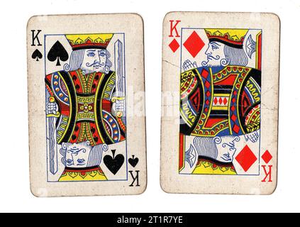 Vintage playing cards featuring a pair of kings on a white background. Stock Photo