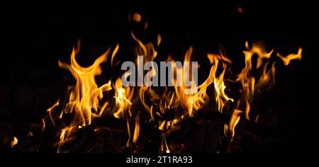 Flames are isolated on black background. Horizontal fire image. Great for burning effects. Stock Photo