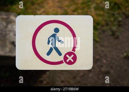 No Trespassing sign in front of a meadow in a park in Germany Stock Photo