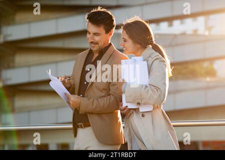 Construction Project Discussion by Business Partners on Street Stock Photo