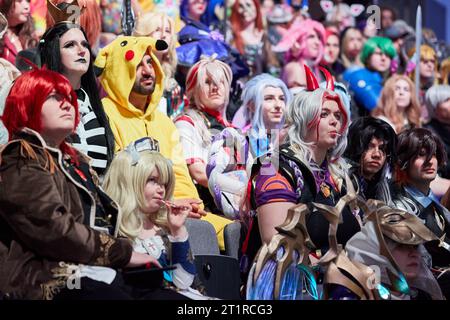Hamburg, Germany. 15th Oct, 2023. Visitors in costumes sit in the auditorium during a world record attempt at the Polaris Convention gaming trade show. They took part in a world record attempt with the largest gathering of video game cosplayers. About 200 exhibitors from the gaming world are represented at the fair. Credit: Georg Wendt/dpa/Alamy Live News Stock Photo