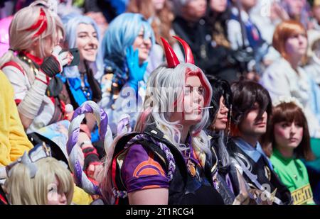 Hamburg, Germany. 15th Oct, 2023. Visitors in costumes sit in the auditorium during a world record attempt at the Polaris Convention gaming trade show. They took part in a world record attempt with the largest gathering of video game cosplayers. About 200 exhibitors from the gaming world are represented at the fair. Credit: Georg Wendt/dpa/Alamy Live News Stock Photo