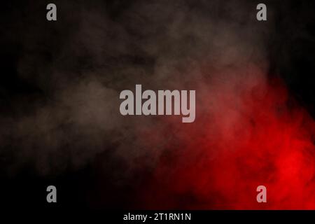 Purple and blue steam on a black background. Copy space. Stock Photo