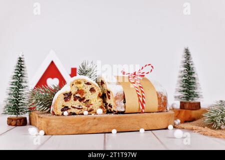 Cut open German Stollen cake, a fruit bread with nuts, spices, and dried fruits with powdered sugar traditionally served during Christmas time Stock Photo