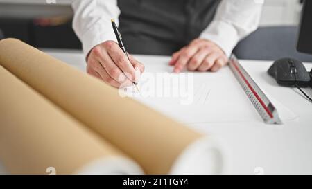 Young hispanic man architect drawing house plans at office Stock Photo