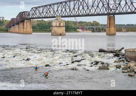 Granite City, Il, USA - October 8, 2023: Two whitewater kayakers playing and training below Low Water Dam on the Mississippi River at Chain of Rocks n Stock Photo