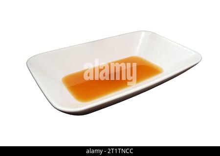 The rusty water gushes out of the faucet, making the sink wet and dirty, isolated on white background. The unclean water flowing from the rusty faucet Stock Photo