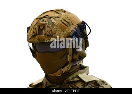 Helmet with headphones for an army radio on a mannequin, isolated on white background. Portable military communications Stock Photo