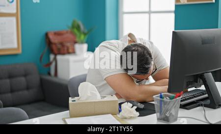 Grey-haired man business worker being sick working at the office Stock Photo