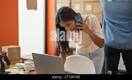 Two workers man and woman working together at office Stock Photo