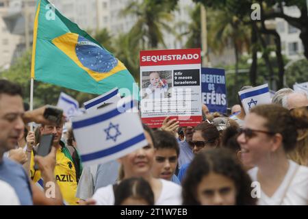 Jewish community marches in support of Israel in the conflict with Hamas, at Copacabana. Jewish people demonstration holding israeli flags and judaism Stock Photo