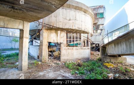 Inside the ruins of an old factory in Romania of a Communist Era. Step inside of abandoned old factory in eastern Europe. Undismantled buildings from Stock Photo