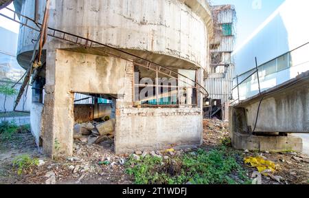 Inside the ruins of an old factory in Romania of a Communist Era. Step inside of abandoned old factory in eastern Europe. Undismantled buildings from Stock Photo