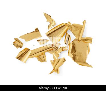 Many pieces of edible gold leaf on white background Stock Photo