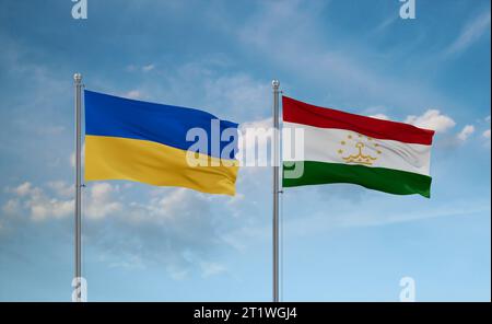 Tajikistan and Ukraine flags waving together in the wind on blue cloudy sky, two country relationship concept Stock Photo