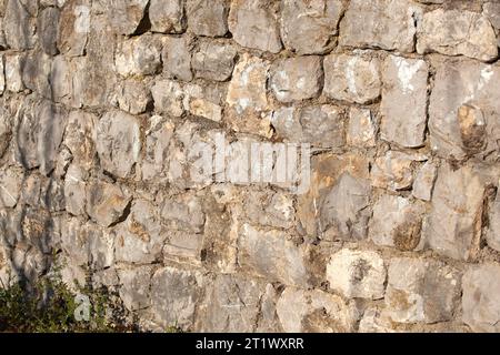 Stone texture. Ancient wall of stones with gray color. Background. Template. Photo in high quality. Horizontal. Stock Photo
