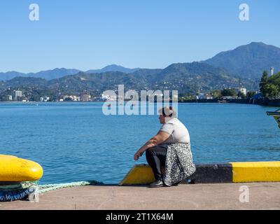 Batumi, Georgia. 10.14.2023 Fishermen in the port of Batumi. Waiting for a peck. People on vacation. Hobbies for people. Day off at the port. Fish cat Stock Photo