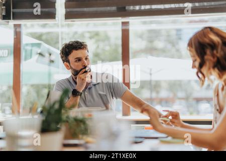 A diverse group of professionals working together in an office, focused on marketing strategies and sales success. Stock Photo