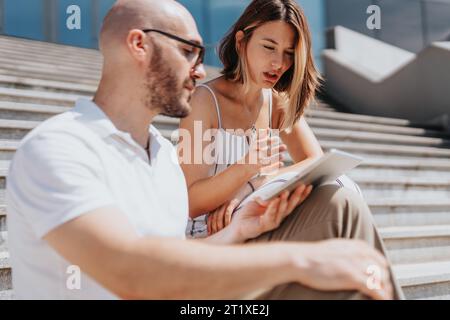 Business Professionals Strategizing and Discussing E-Commerce Trends for Profit Growth Stock Photo