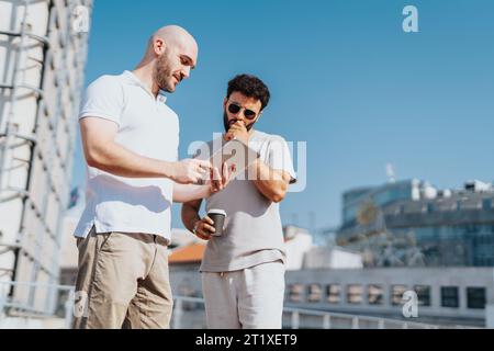 Successful Urban Architects Collaborating on Modern Infrastructure Project Stock Photo