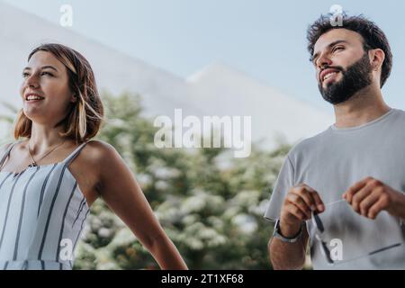 A diverse group of professionals collaborating outdoors, reviewing reports, and planning strategies. Efficient teamwork for business success. Stock Photo
