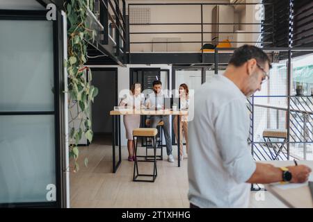 Efficient Team Analyzing Reports and Developing Strategic Business Plan Stock Photo