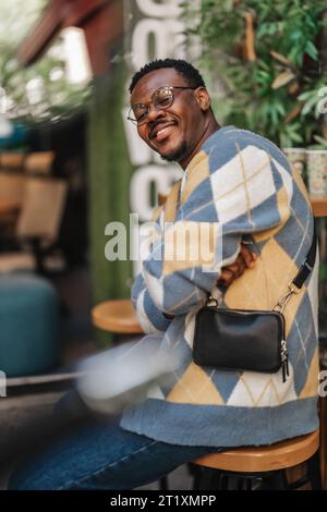 Black male worker posing for the camera during break at work. Stock Photo