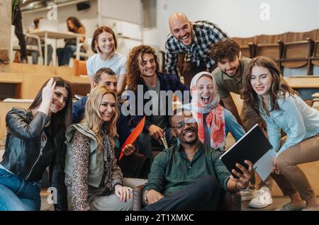 Multiracial businesspeople taking a selfie. Creating memories at work. Good memories. Employees having fun Stock Photo