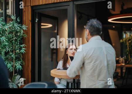 Successful Business Leaders Discussing Project Strategies for Better Efficiency and Growth Stock Photo