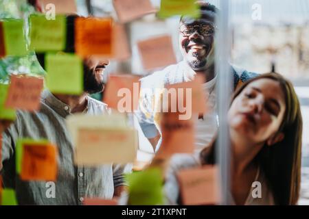 Multiracial Business Team Brainstorming and Planning Strategy in Modern Office Stock Photo