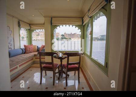 Udaipur, Rajasthan, India, 09/16/2023: Taj Lake Palace Hotel on Lake Pichola. The bedroom window offers a view of the City Palace across the lake. Stock Photo
