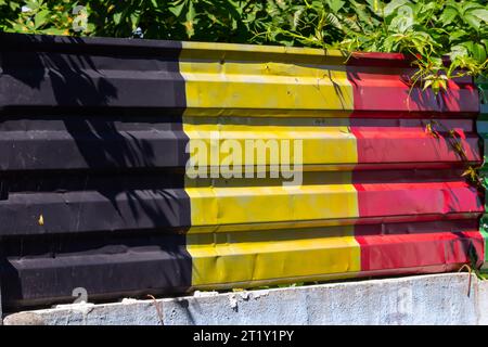 Belgian Flag on grunge metal texture background. Stock Photo
