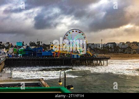 The famous Ferris wheel on the beach and Santa Monica pier under a splendid Californian sun, this beach in Los Angeles has been the setting. Stock Photo