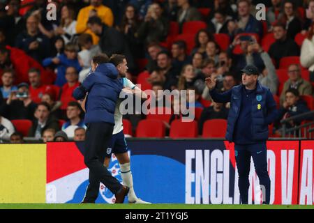 Manager of England, Gareth Southgate embraces Jordan Henderson of England after he is substituted to booing England fans - England v Australia, International Friendly, Wembley Stadium, London, UK - 12th October 2023. Stock Photo