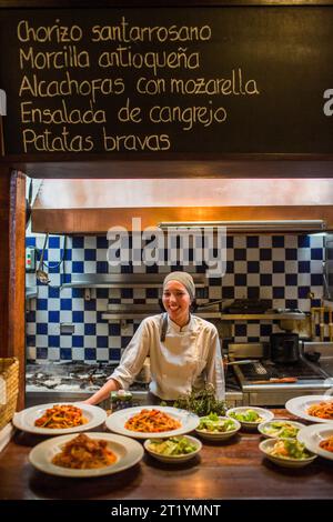 Laura Silva prepares food at Donostia, a restaurant in Bogota, Colombia. Stock Photo