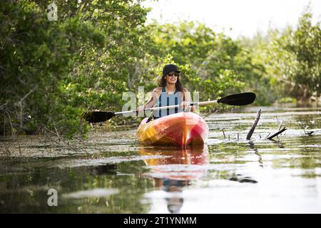 Front view of woman kayaking Stock Photo