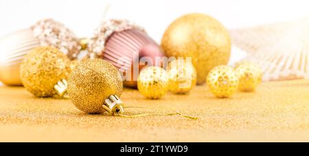 Pile of bright Christmas gold baubles. Stock Photo