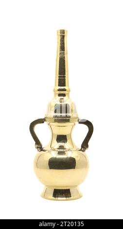 a slim and tall vintage flask pot used as a holy water dispenser bottle made of gold with symmetric curvy design isolated in a white background Stock Photo