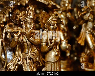 closeup of hindu god lord krishna and radha sculpture in an antique store for vintage idols and gifts Stock Photo