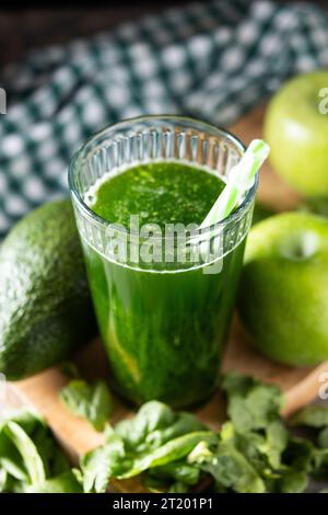 Green smoothie detox with Kale, avocado and apples on wooden table Stock Photo
